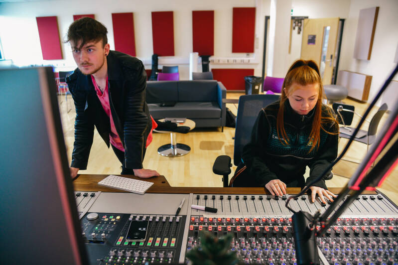 Students using mixing desk in SRC music studio
